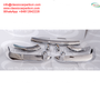 A set of polished chrome bumpers for Alfa Romeo Giulietta Spider S2 S3 and Giulia Spider models from 1955 to 1965, displayed in a symmetrical arrangement