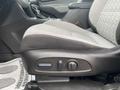 A close-up view of the driver's seat of a 2022 Chevrolet Equinox featuring gray fabric upholstery and adjustment controls on the side