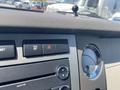 Interior dashboard controls of a 2013 Ford Expedition including buttons for TCS and hazard lights