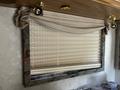 2000 Ford Motorhome with interior features including window coverings and decorative trim