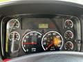 Dashboard of a 2010 Freightliner M2 106 featuring various gauges including speedometer fuel oil and temperature indicators