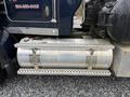 The image shows a metallic fuel tank mounted on the side of a 2018 Kenworth T800 truck with perforated metal steps leading up to the cab