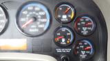 Dashboard of a 2012 International 7400 showing various gauges including speedometer fuel level voltmeter and air pressure indicators