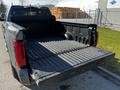 A 2023 Toyota Tundra with its tailgate down and a clean, empty truck bed visible