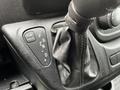 Close-up of the gear shift lever and controls in a 2021 RAM Promaster showing options for tow haul and transmission settings
