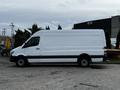 A white 2016 Mercedes-Benz Sprinter van parked with a streamlined design and large side cargo area