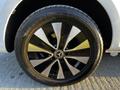 A close-up view of a black and silver alloy wheel from a 2022 Mercedes-Benz Metris showcasing the brand logo in the center