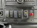 Control panel of a 2019 Chevrolet Express featuring buttons for doors interior lights ramp and shift lock