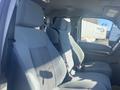 Interior of a 2014 Ford F-250 SD showing two front seats with gray upholstery and seat belts equipped