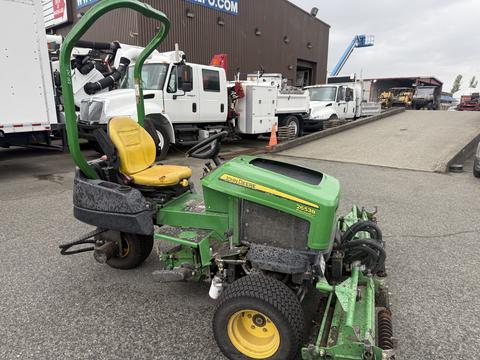 2009 John Deere 2653B Precision Diesel Mower with a yellow seat and green body featuring multiple blades and wheels for cutting grass