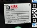 A metal identification plate for a HIAB loader crane with details including type number 211 EP-5CX and serial number BL211CL00028
