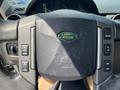 Steering wheel of a 2006 Land Rover LR3 featuring control buttons and the Land Rover logo in the center