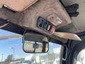 Interior view of a 2018 Kubota RTV-X 1100 C showing overhead controls and a rearview mirror