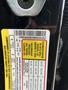 A label on a 2021 Ford Explorer providing tire and loading information with details in multiple languages