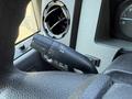Close-up of the turn signal and light control stalk on a 2012 Ford F-350 SD with textured grip and various control buttons