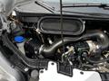 The image shows the engine compartment of a 2022 Ford Transit featuring various mechanical components including a large air intake and visible hoses and wires