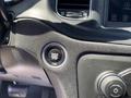 A close-up of the ignition button in a 2019 Dodge Charger featuring the text Engine Start Stop with an illuminated orange light