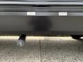 Close-up of a 2021 Jayco Jay Flight with labeled water tank valves for black and grey water holding tanks