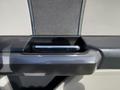 The image shows the interior door handle of a 2018 Ford F-150 designed with a sleek and functional look in a combination of black and gray materials