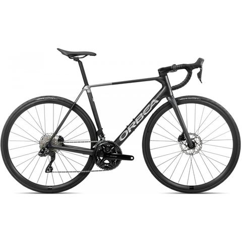 2026 Orbea ORCA M30i Road Bike featuring a sleek black frame with aerodynamic design and disc brakes ideal for road performance and speed