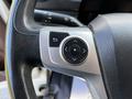 Close-up of the steering wheel control panel of a 2021 Hino 338 featuring a multi-functional button cluster for navigation and other features