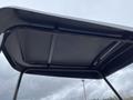 View of the underside of the roof of a 2024 AGT Industrial KRW23 Mini Loader with a metal frame and smooth surface