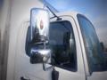 A close-up of a 2013 Hino 308 truck's side mirror and door window showing the chrome mirror housing and orange indicator light