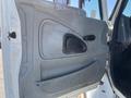 The image shows the interior door panel of a 2007 International 7300 featuring a gray plastic design with a door handle and a speaker grille