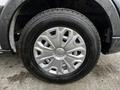 Close-up of a silver wheel with five spokes and a black tire from a 2020 Ford Transit