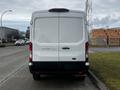 A white 2020 Ford Transit van viewed from the rear with a clean design and no visible markings or additional features