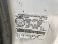 A 2002 Ford F-550 vehicle identification label with specifications including weight and dimensions