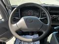 Steering wheel of a 2009 Ford LCF 550 with gauges and controls visible in the dashboard area