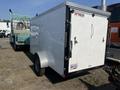 White 2020 Mirage Enterprises 12 Foot Cargo trailer with a single axle and double doors at the back
