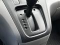 The gear shift of a 2020 Nissan NV200 featuring the shift lever with positions for park reverse neutral drive and low