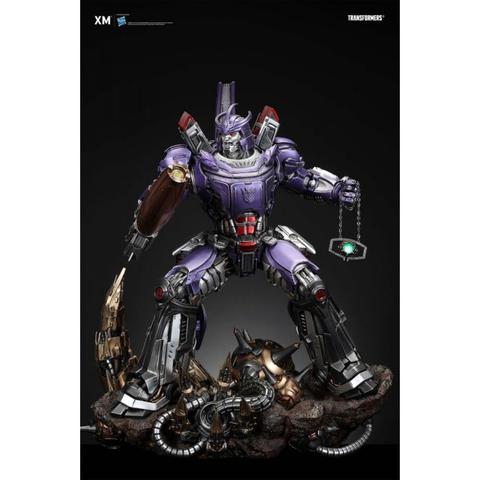 Transformers Galvatron 1/10 scale limited edition statue featuring a purple robotic figure with a prominent chest piece holding a chain and standing on a rocky base with mechanical details