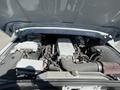 The engine compartment of a 1962 Ford F-100 showing a modern engine setup with various components and wiring visible