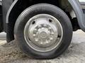 Close-up of a shiny metal wheel rim and tire of a 2008 International CityStar showing the brand name Continental and tread pattern