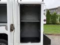 The interior of a 2020 Ford F-550 service vehicle featuring empty storage compartments with no visible items inside