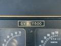 Close-up of a dashboard gauge panel showing the label G.V.W. 11500 with two analog speedometer gauges beneath it