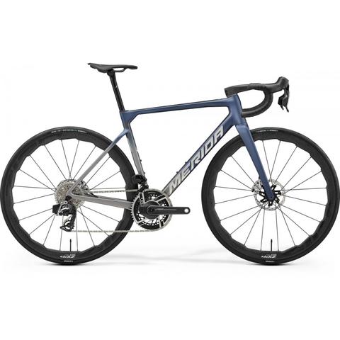 2026 Merida Scultura 10K Road Bike features a sleek blue and silver frame with aerodynamic lines disc brakes and high-performance components