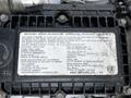 A close-up of an engine information label from a 2014 Hino 195 truck detailing specifications and manufacturer information