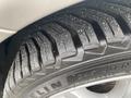 Close-up of a Michelin tire showing a detailed tread pattern on a 2007 Mercedes-Benz E-Class