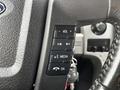 Steering wheel controls of a 2014 Ford F-150 including volume media and OK buttons