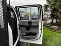 A 2020 Ford F-350 SD truck door is open showing the interior design and panel with a light color scheme