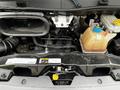 Engine compartment of a 2018 RAM Promaster with visible engine components and a coolant reservoir