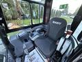 Interior of a 2023 Sany SY35U excavator featuring a driver's seat control panel and joystick