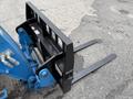 A 2020 Genie GTH-5519 telehandler attachment with a black fork frame and two elongated forks positioned horizontally