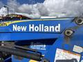 A 2010 New Holland T4050 tractor with a blue and yellow color scheme featuring the brand name prominently displayed on the side