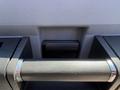 Close-up of the handle of a 2014 Ford F-250 SD with a textured grip and chrome accents