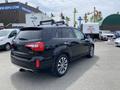 A black 2015 Kia Sorento parked with a roof rack and sporty design showcasing its rear and side profile